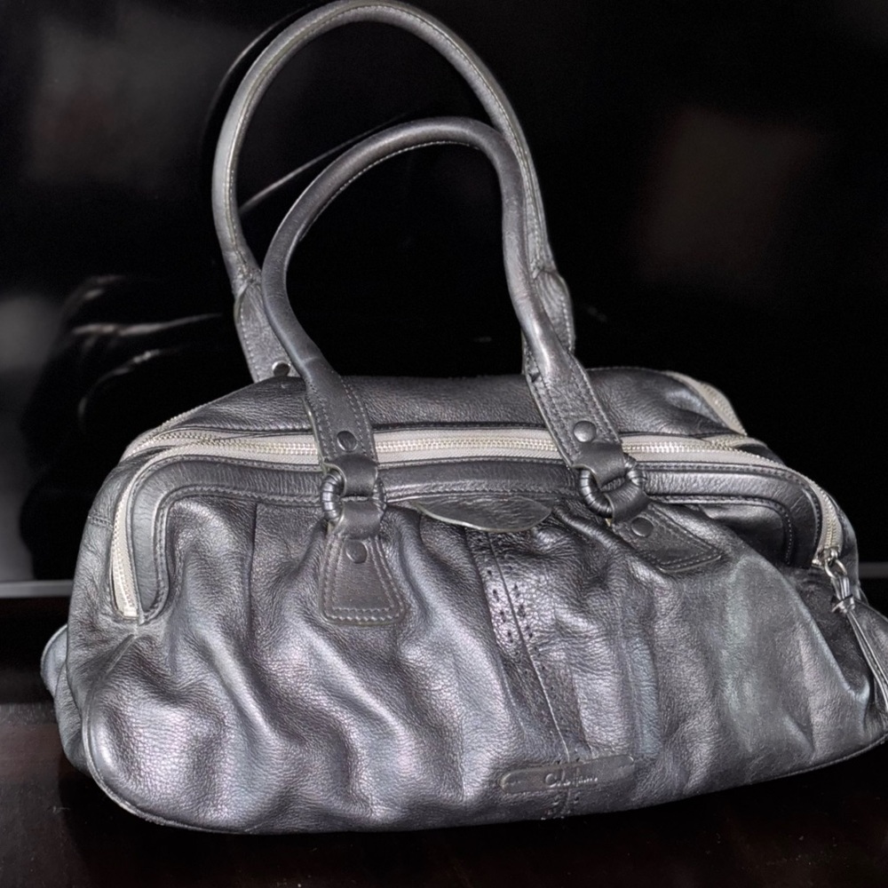 Cole Haan Pewter oversized handbag with detailed work. Very good condition